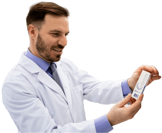 Pharmacist holding a package of a pharmaceutical product.